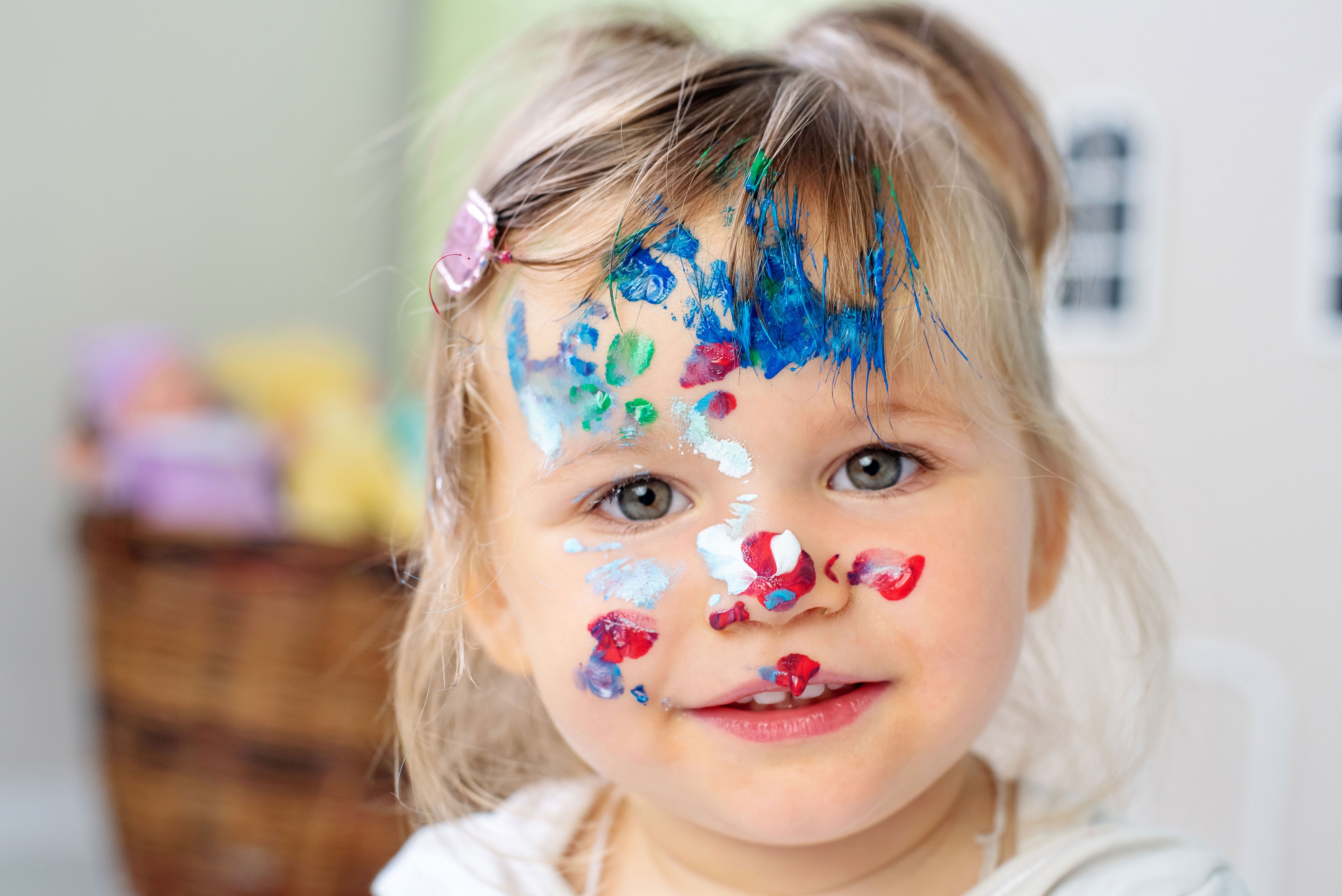 Child with paint on face